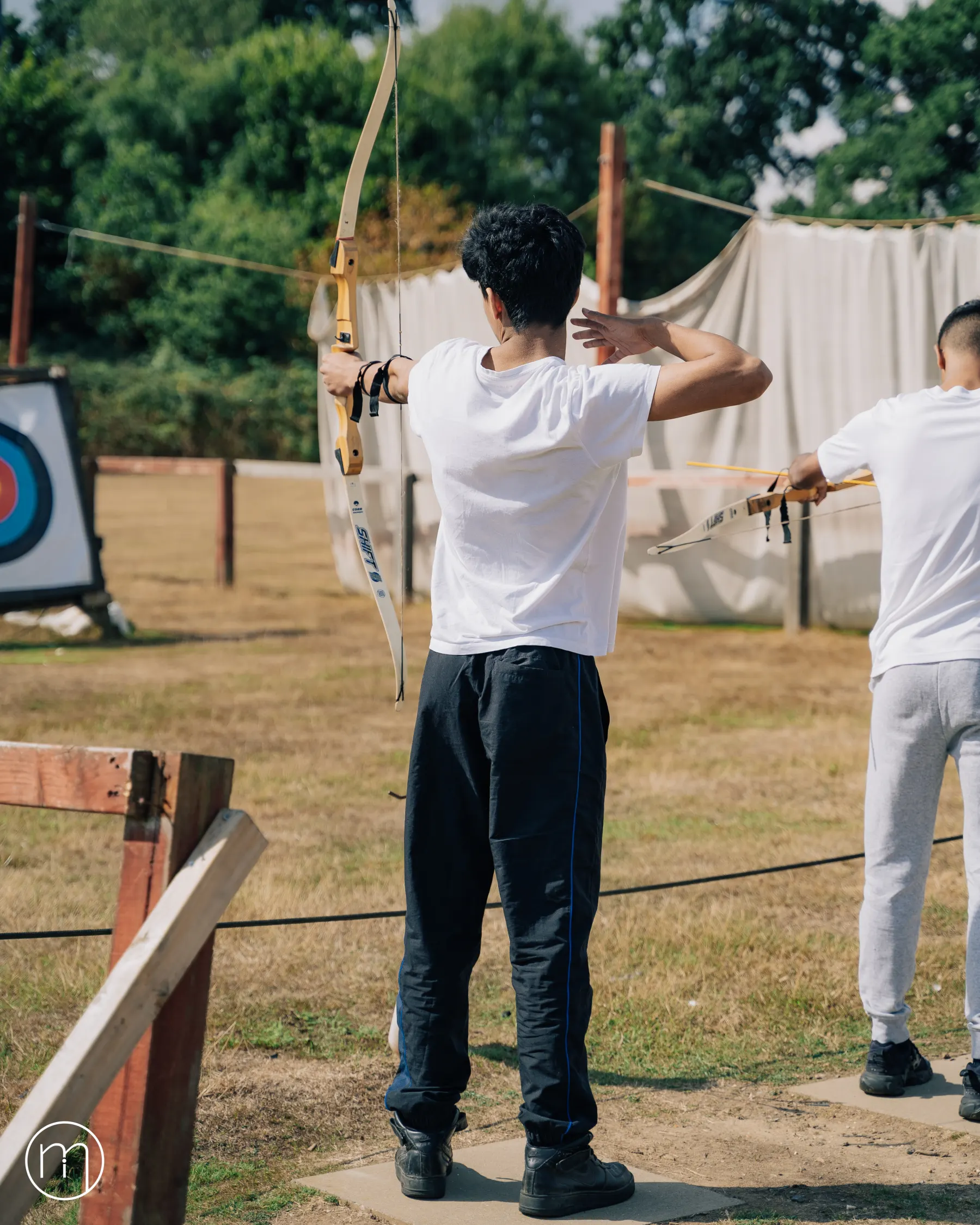 A participant aiming during archery