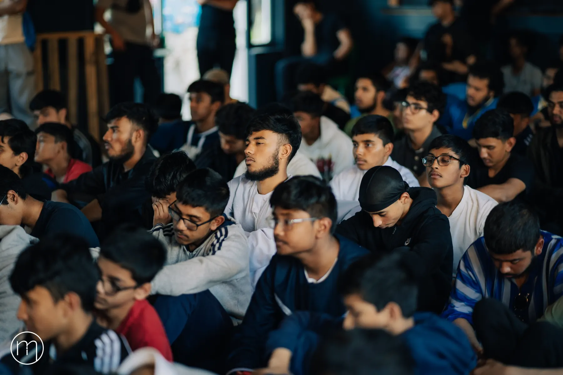 Participants listening during an indoor session