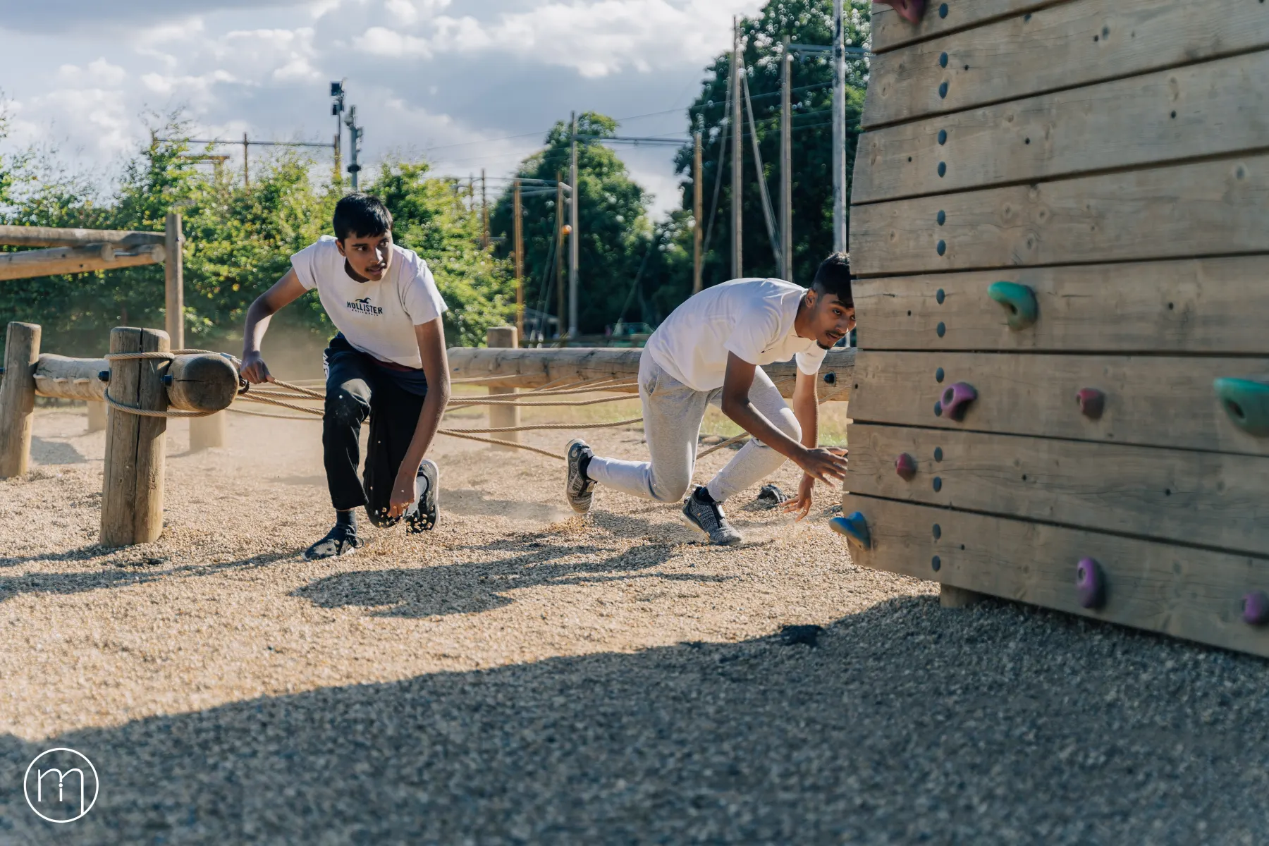 Participants taking part in a climbing wall activity